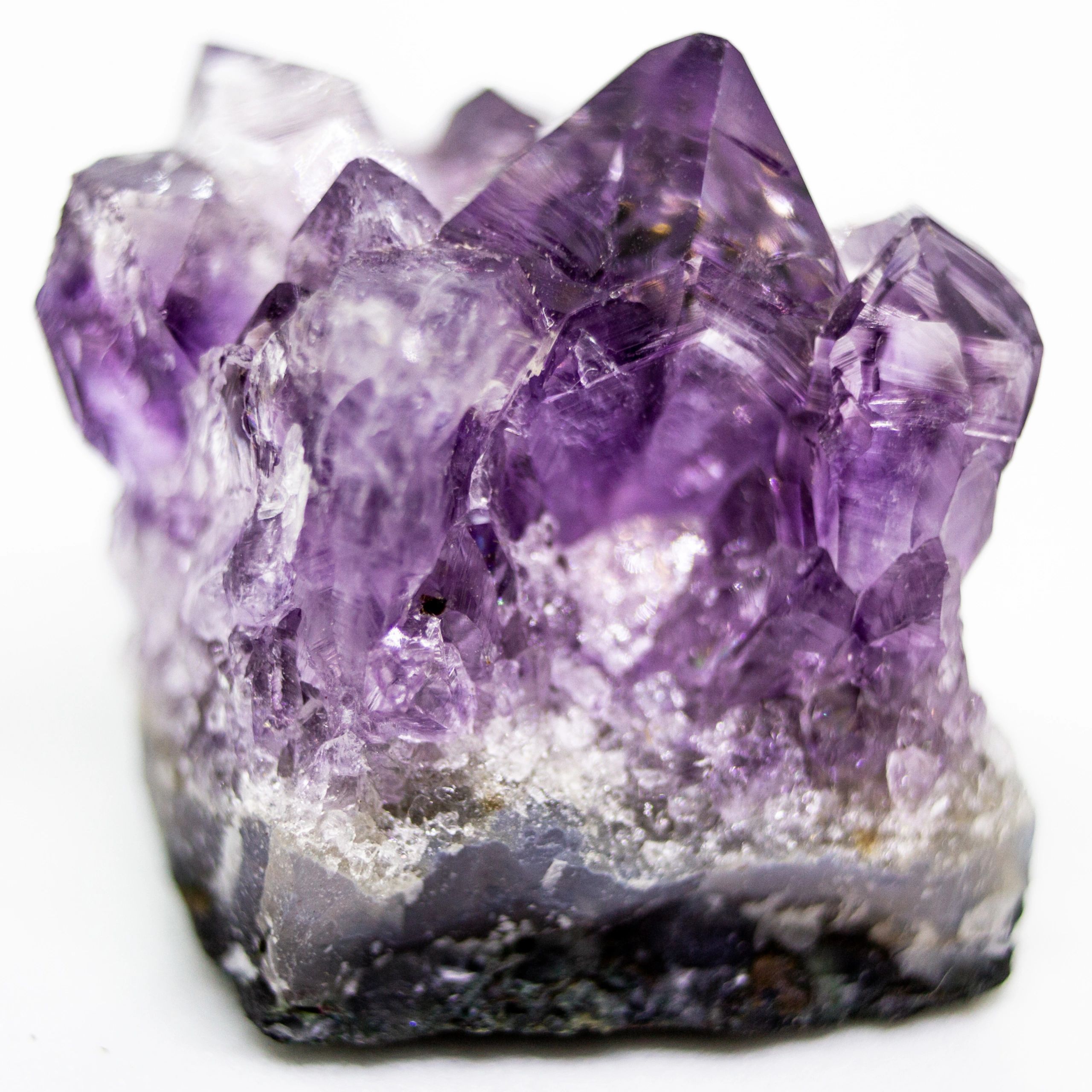 Amethyst cluster photographed on a clean white background